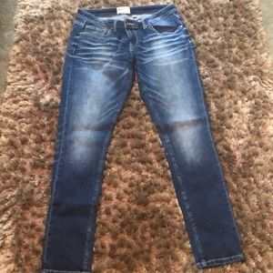Distressed blue jeans